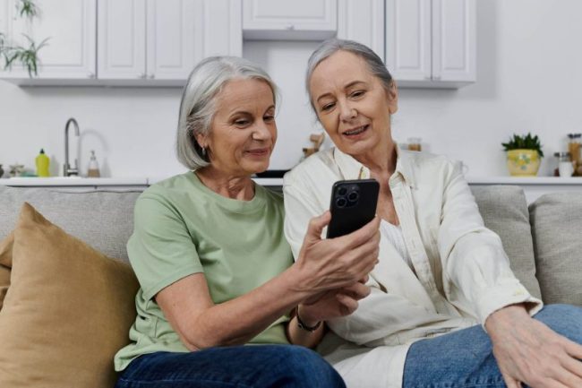 Two,Elderly,Lesbians,Relax,On,A,Couch,Post-cleaning,,One,Smiling Dental Technology in Spirit Lake
