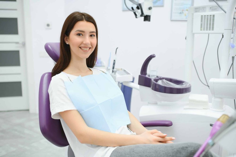 The,Girl,Is,At,The,Reception,At,The,Dentist.,A dentist near me